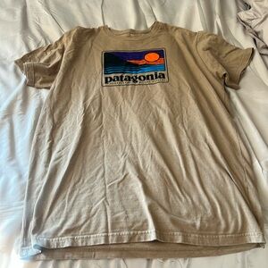 Tan colored Patagonia T-shirt, in good shape